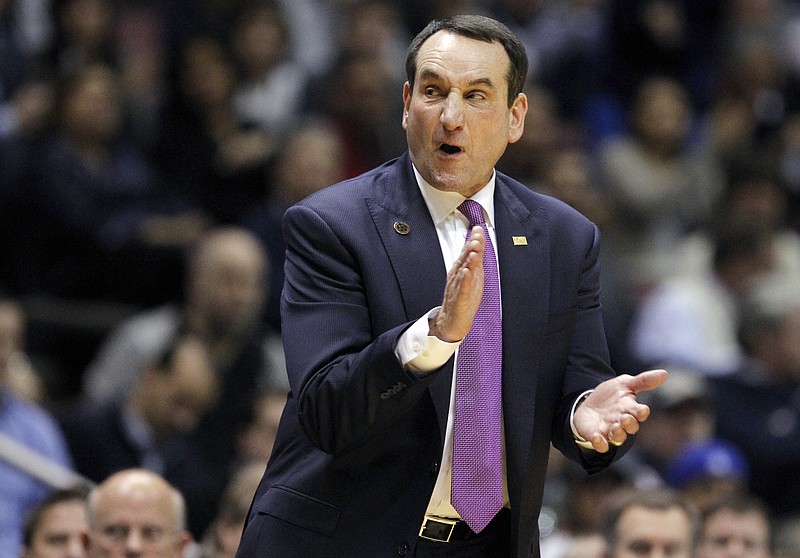 Duke head coach Mike Krzyzewski claps during an NCAA college basketball game. The celebrated coach made an inspirational phone call to the bedside of Navy Petty Officer Randall Smith while he fought for his life at Erlanger hospital.