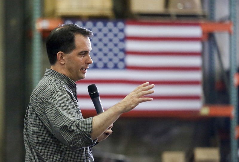 
              Republican presidential candidate Wisconsin Gov. Scott Walker addresses a crowd at Giese Manufacturing, Sunday, July 19, 2015, in Dubuque, Iowa. (Mike Burley/Telegraph Herald via AP)
            