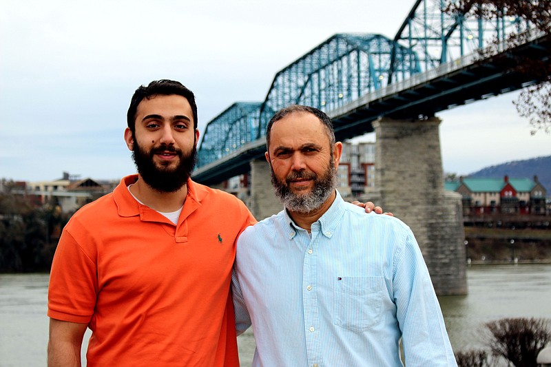 Mohammad Youssef Abdulazeez smiles with his father, Youssef, on the Walnut Street Bridge in a photo taken earlier this year. 