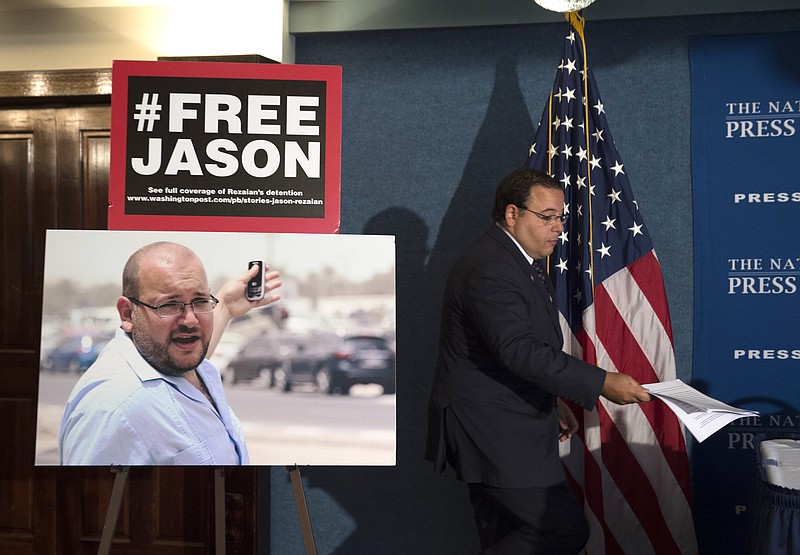 
              Ali Rezaian, brother of Jason Rezaian, The Washington Post's Tehran Bureau Chief who is currently in Evin Prison in Iran, arrives at a news conference at the National Press Club to give an update on the case in Washington, Tuesday, July 22, 2015. The Washington Post, stymied in its efforts to win the release of journalist Rezaian from Iran, has filed an urgent petition asking help from a United Nations agency. Rezaian was arrested over a year ago and has been held for months without charges in Iran's Evin Prison. (AP Photo/Molly Riley)
            