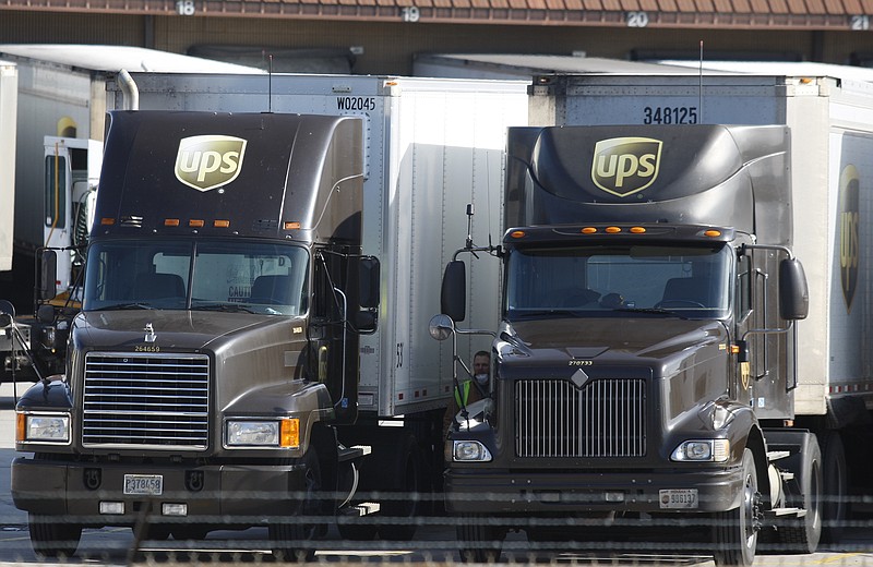 UPS trucks are lined up Thursday, Dec. 26, 2013, at the UPS shipping facility in Chattanooga