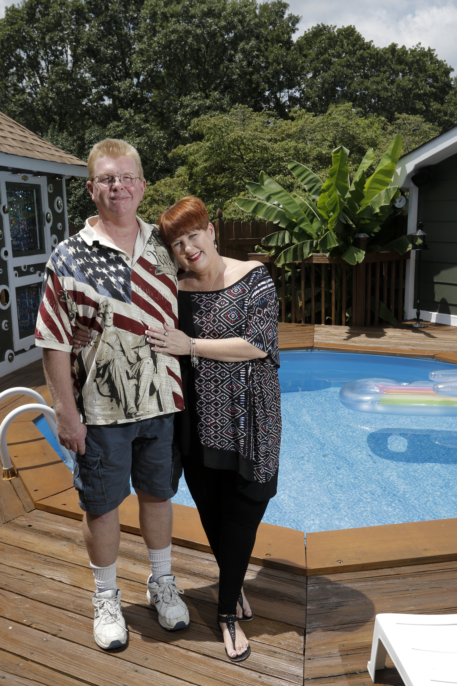 Larry and Shannon Bennett stand near their above-ground pool and deck work Saturday, July 18, 2015, at their home in Ooltewah, Tenn.