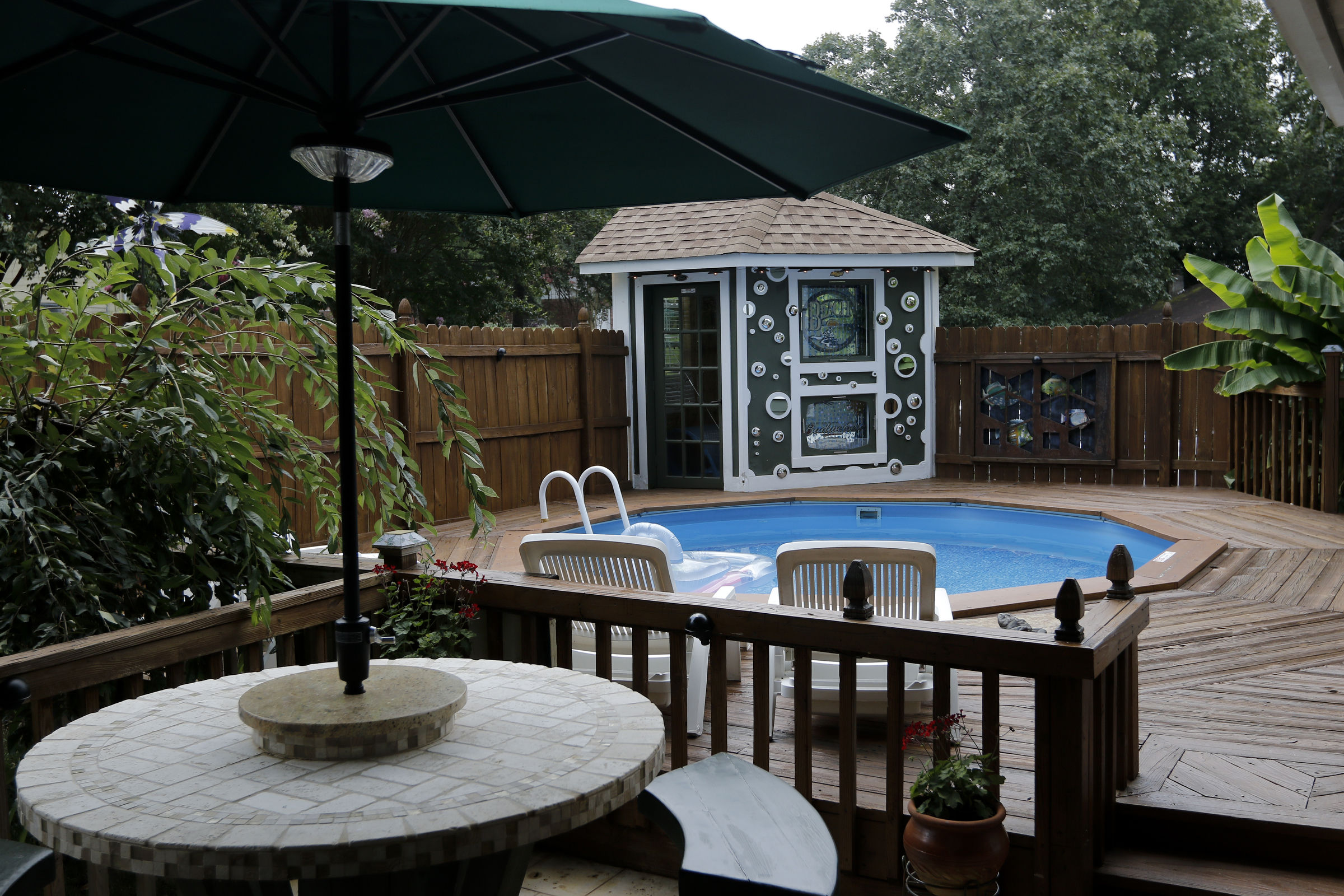 The above ground pool of Larry and Shannon Bennett and its surrounding deck work is seen Saturday, July 18, 2015, at their home in Ooltewah, Tenn.
