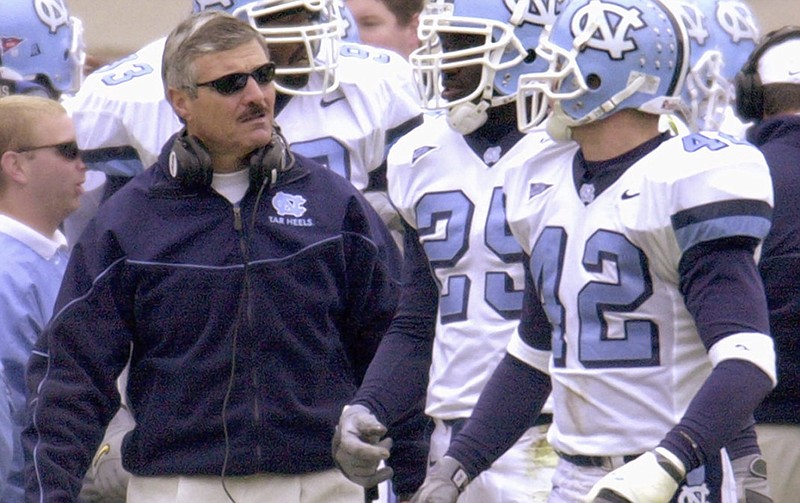 Carl Torbush, shown during the 2000 season — his final year as head football coach at the University of North Carolina — will lead East Tennessee State University this season as it returns to the football field for the first time in 12 years.