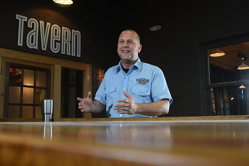 Dustin Choate, general manager at the Feed Company Table and Tavern, talks about the wood decor and benefits of clustering fine restaurants in one area of the Southside.