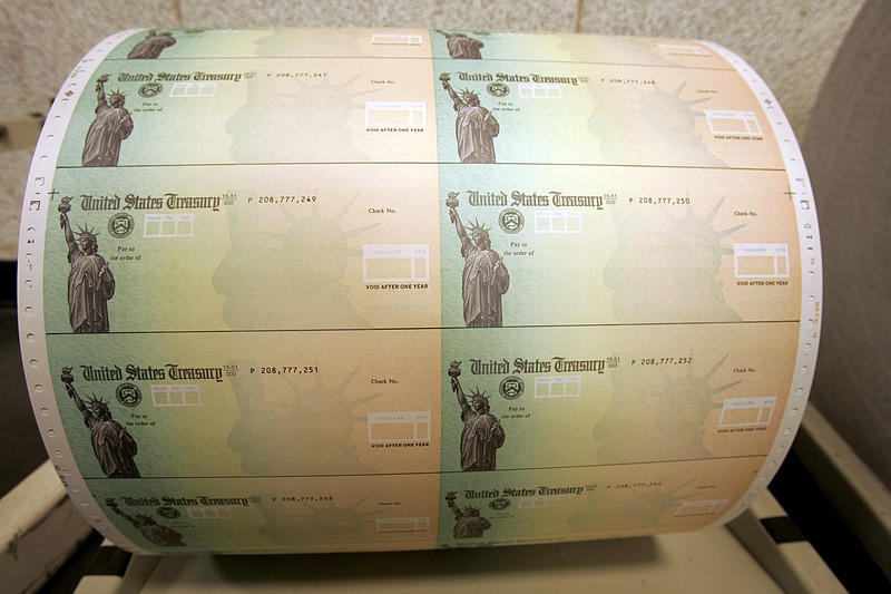 U.S. Treasury checks are shown on a roll at the Philadelphia Financial Center, which disburses payments on behalf of federal agencies such as the Social Security Administration.