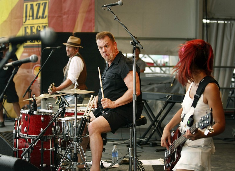 Fred LeBlanc, center, front man for the band Cowboy Mouth, performs with the group at the New Orleans Jazz and Heritage Festival in New Orleans, Saturday, April 24, 2010. (AP Photo/Gerald Herbert)