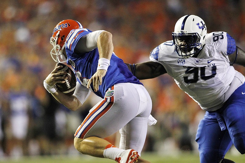 Kentucky senior defensive tackle Melvin Lewis was a 12-game starter last season but appreciates more being the first male in his family to graduate from college.