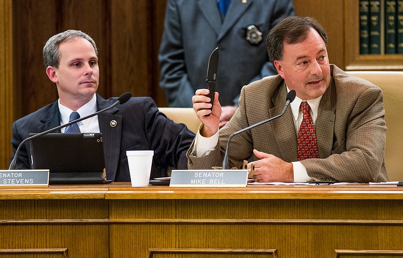 In this 2013 file photo, Sen. Mike Bell of Riceville displays a knife during a Senate Judiciary Committee hearing as Sen. John Stevens of Huntingdon looks on. On Thursday, Bell and Rep. Jeremy Faison, chairmen of their respective House and Senate operations committees, said the panels will hold a joint "fact-finding" hearing next month to examine enforcement of Tennessee's law banning sales of aborted fetuses in the wake of a controversy over the issue regarding national Planned Parenthood.