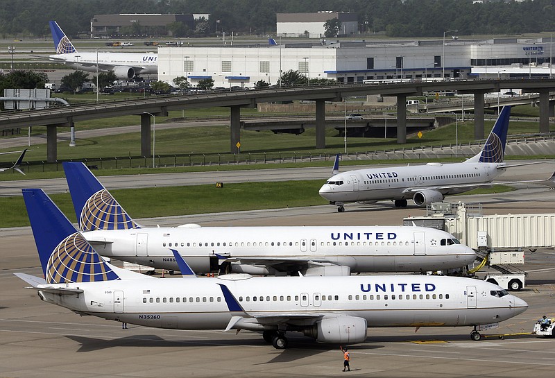 
              FILE - In this July 8, 2015, file photo, a United Airlines plane, front, is pushed back from a gate at George Bush Intercontinental Airport in Houston. United Airlines reports quarterly financial results on Thursday, July 23, 2015. (AP Photo/David J. Phillip, File)
            