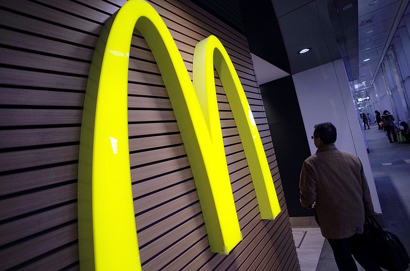 A man walks by a McDonald's restaurant in this file photo.