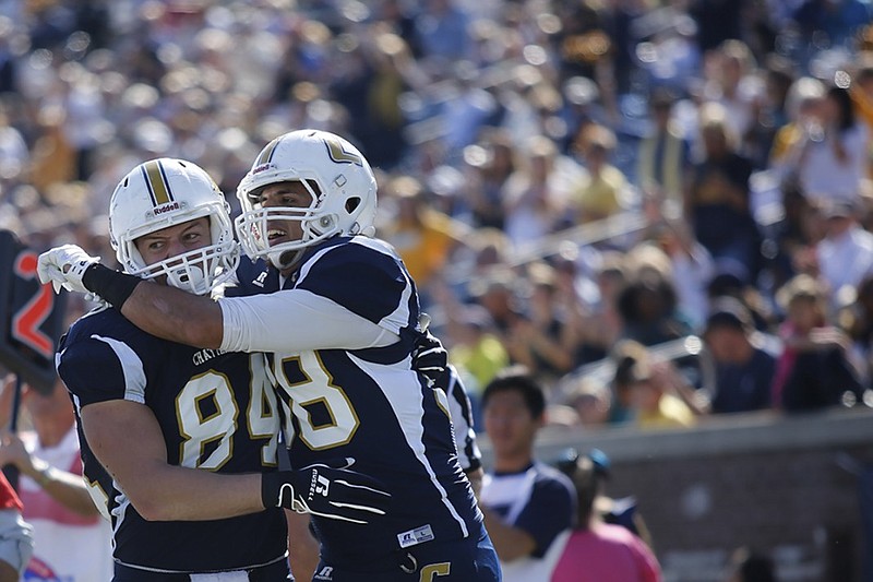 UTC tight ends Troy Dye, left, and Faysal Shafaat celebrate a touchdown during the Mocs' game against Mercer last season. Shafaat earned All-American honors for the second time last year as a senior. Dye was the most experienced returning tight end for the 2015 season, but has decided not to use his final year of eligibility
