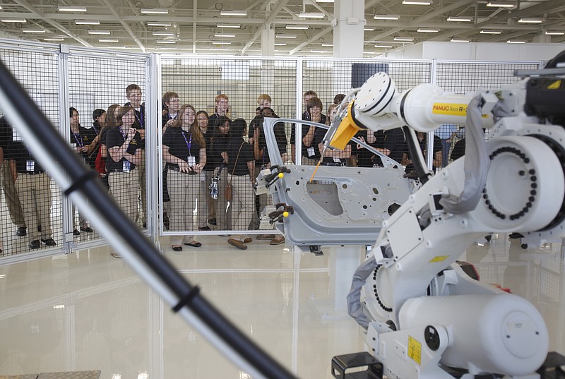 Staff file photo/ One of the robotic stations in the Volkswagen Academy at VW's auto assembly plant in Chattanooga is viewed by students.