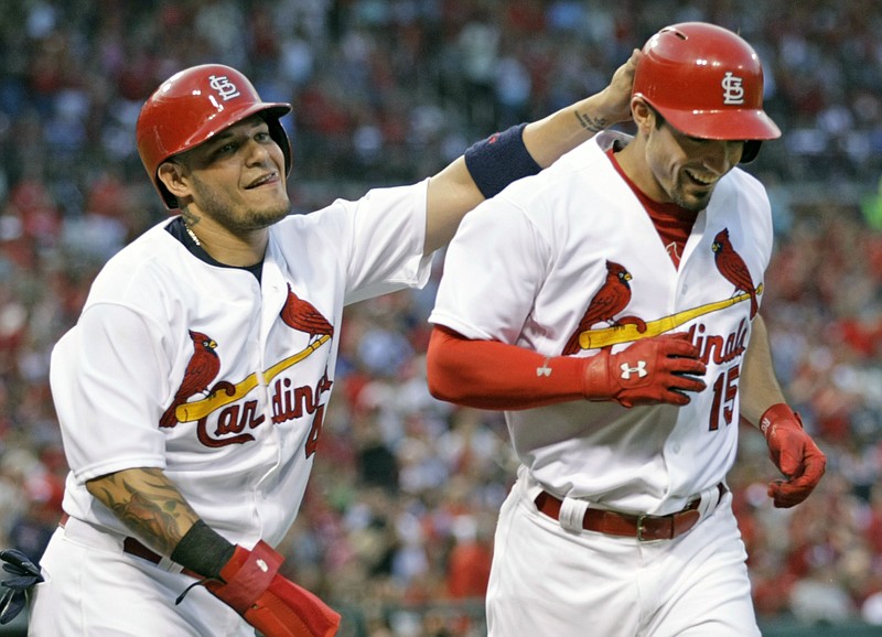 St. Louis Cardinals' Yadier Molina, left, congratulates teammate Randal Grichuk on his two run home run in the second inning of a baseball game against the Atlanta Braves, Friday, July 24, 2015 in St. Louis.