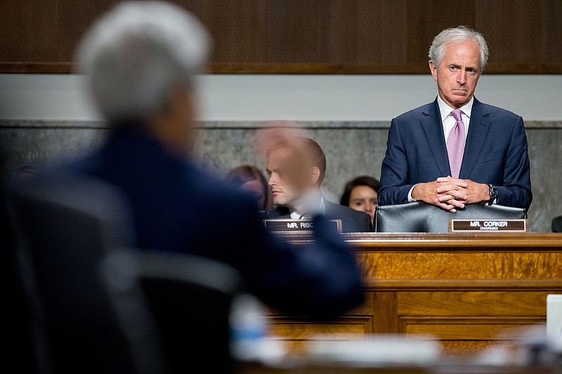 Chairman Sen. Bob Corker, R-Tenn, right, listens as Secretary of State John Kerry, left foreground, Secretary of Treasury Jack Lew, and Secretary of Energy Ernest Moniz, testify at a Senate Foreign Relations Committee hearing on Capitol Hill in Washington, Thursday, July 23, 2015, to review the Iran nuclear agreement.