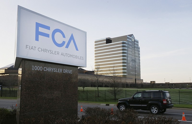 
              FILE - In this Tuesday, May 6, 2014, file photo, the Fiat Chrysler Automobiles sign is seen after being unveiled at Chrysler World Headquarters in Auburn Hills, Mich. The U.S. government will fine Fiat Chrysler a record $105 million for violating safety laws in a series of recalls, a person briefed on the matter says. The National Highway Traffic Safety Administration will reveal the fine on Monday, July 27, 2015, says the person who didn't want to be identified because the official announcement hasn't been made. (AP Photo/Carlos Osorio, File)
            