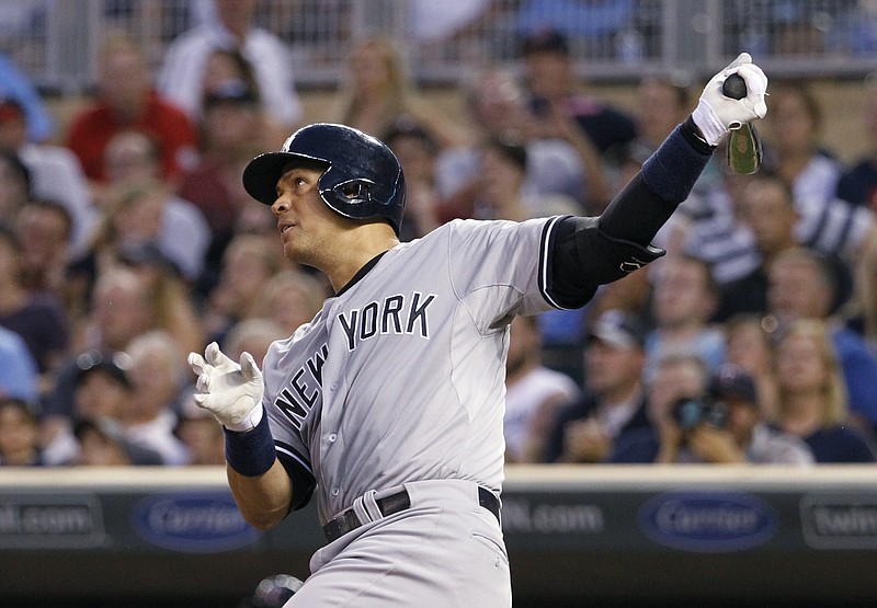 
              New York Yankees' Alex Rodriguez follows through on a solo home run off Minnesota Twins relief pitcher Glen Perkins during the ninth inning of a baseball game in Minneapolis, Saturday, July 25, 2015. The Yankees won 8-5. (AP Photo/Ann Heisenfelt)
            