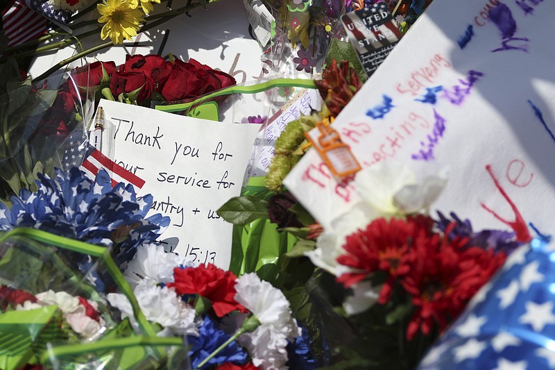Members of the community left trinkets at a makeshift memorial on July 17, in front of the Armed Forces Career Center off of Lee Highway where a shooting spree began leading to the death of four Marines in Chattanooga.