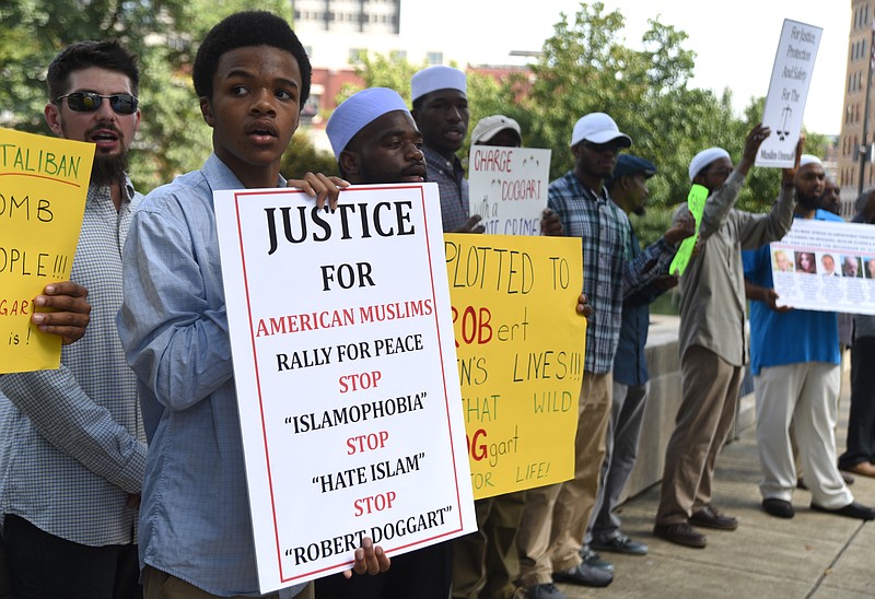 Tavari Abdul Hakeem, second from left, and other Muslims rally near the Joel W. Solomon Federal building on July 13, 2015 to protest what they see as light treatment of Robert Doggart, who plotted to murder Muslims in Islamberg, N.Y.