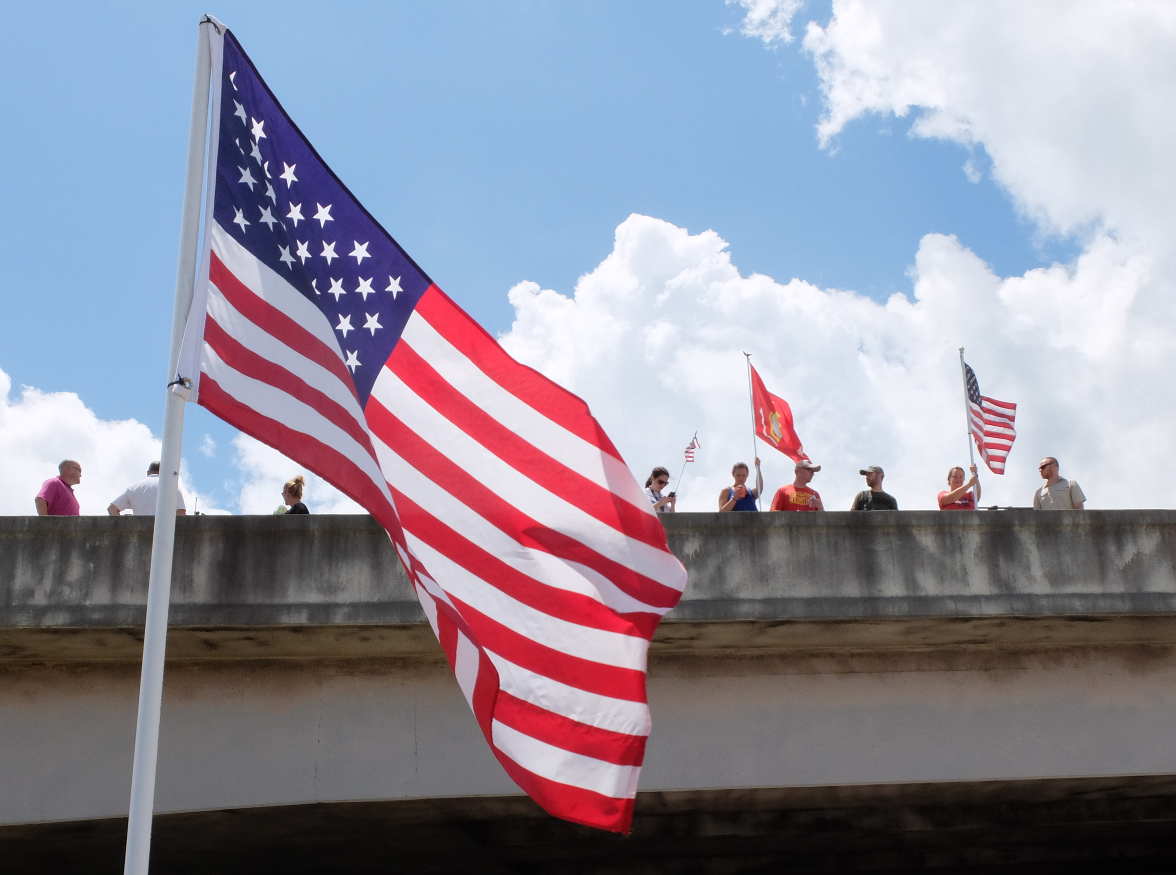 People line the DuPont Parkway over Amnicola Highway Friday.