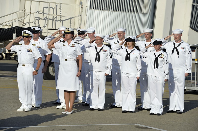 Sailors assigned to Navy Operational Support Center Chattanooga perform plane side honors as the remains of Navy Petty Officer 2nd Class Randall Smith arrive at Nashville International Airport, Friday, July 24, 2015, in Nashville, Tenn. Smith was killed by a gunman in Chattanooga, Tenn. 