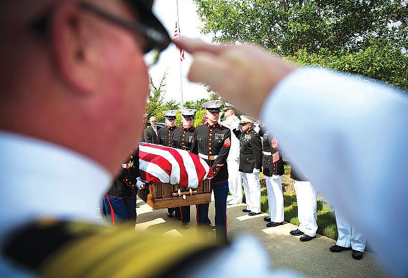 U.S. Marines carry the casket of Lance Cpl. Squire Wells, known as "Skip," to his burial ceremony at Georgia National Cemetery, Sunday, July 26, 2015, in Canton, Ga. The 21-year-old Wells was killed July 16 when a man opened fire at two military facilities before being killed by police in Chattanooga, Tenn. (AP Photo/David Goldman)