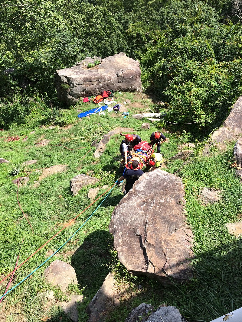 Crews work to rescue a man who fell off a cliff on Signal Mountain.