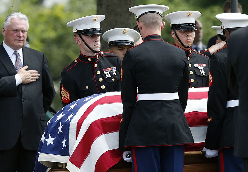 Marine pallbearers carry the casket with the remains of Marine Gunnery Sgt. Thomas Sullivan following his funeral service at Holy Cross Church in Springfield, Mass., on Monday. Sullivan was one of five service members shot to death in the July 16 attack in Chattanooga.