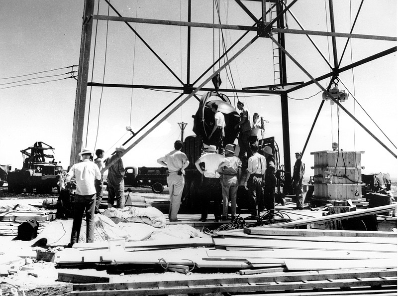 
              FILE - In this July 1945, file photo, scientists and workmen rig the world's first atomic bomb to raise it up into a 100-foot tower at the Trinity bomb test site in the desert near Alamagordo, N.M. "The Bomb," which begins airing Tuesday, July 28, 2015, on most PBS stations, seeks to tell the story of the deadly device as the 70th anniversary of the atomic bombings of Hiroshima and Nagasaki approaches. (AP Photo/File)
            