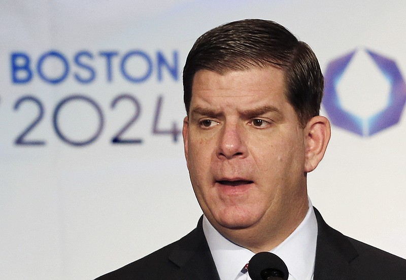 In this Jan. 9, 2015, file photo, Boston Mayor Martin Walsh speaks during a news conference in Boston after the city was picked by the USOC as its bid city for the 2024 Olympic Summer Games. Walsh said Monday, July 27, 2015, he won't sign a host city contract, which is key to the city's bid, without more assurances that taxpayers won't foot the bill.