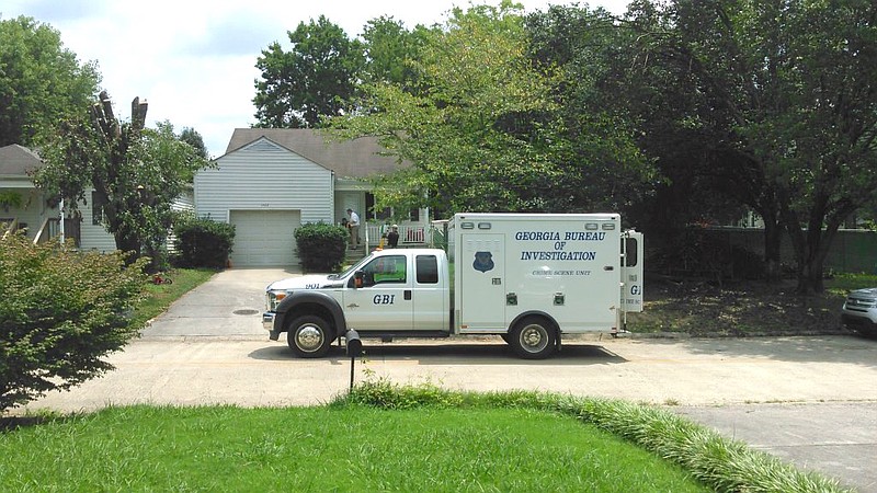 Sheriff's Investigators and GBI Agents collect evidence at the scene of a homicide, 1402 Classic Chase Dr. in Dalton, Ga.