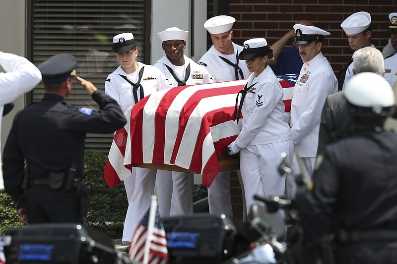 
              Pallbearers carry the casket of Petty Officer 2nd Class Randall Scott Smith out of the First Baptist Church in Fort Oglethorpe, Ga., before transporting him to the Chattanooga National Cemetery on Tuesday, July 28, 2015. Scott was one of five servicemen whose death was the result of a series of shootings at military facilities in Chattanooga, Tennessee, on July 16, 2015. (Dan Henry/Chattanooga Times Free Press via AP) MANDATORY CREDIT: DAN HENRY/CHATTANOOGA TIMES FREE PRESS NOOGA.COM, CLEVELAND DAILY BANNER & DALTON DAILY CITIZEN OUT
            