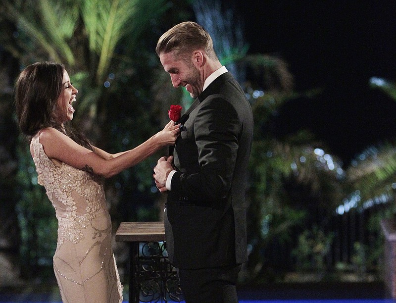 
              In this image released by ABC, Kaitlyn Bristowe, left, and Shawn Booth appear on the season finale of "The Bachelorette." The bachelorette and her chosen fiancé are finally able to live their love away from TV cameras after Monday night’s  finale where Bristowe chose the 29-year-old personal trainer as her one true love. (Rick Rowell/ABC via AP)
            