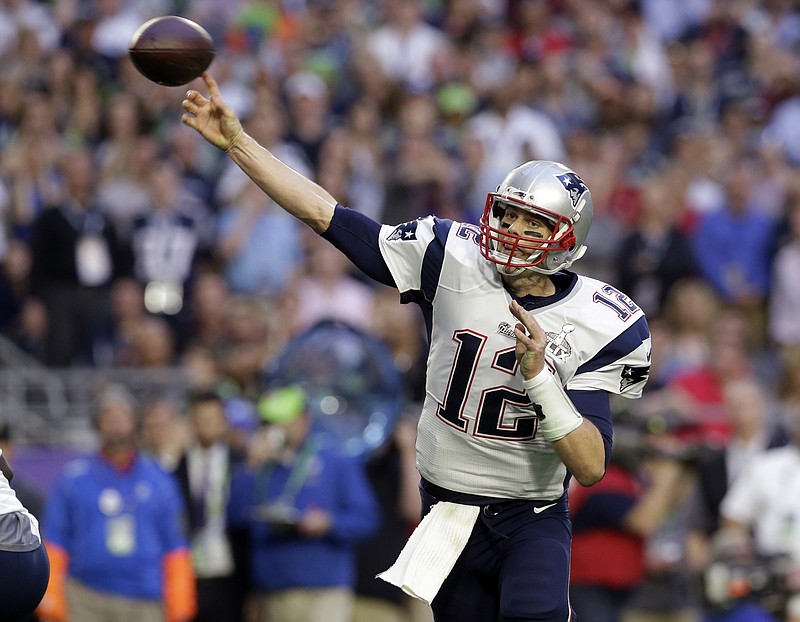 
              FILE - In this Feb. 1, 2015, file photo, New England Patriots quarterback Tom Brady (12) throws a pass during the first half of the NFL Super Bowl XLIX football game against the Seattle Seahawks in Glendale, Ariz. (AP Photo/Patrick Semansky)
            