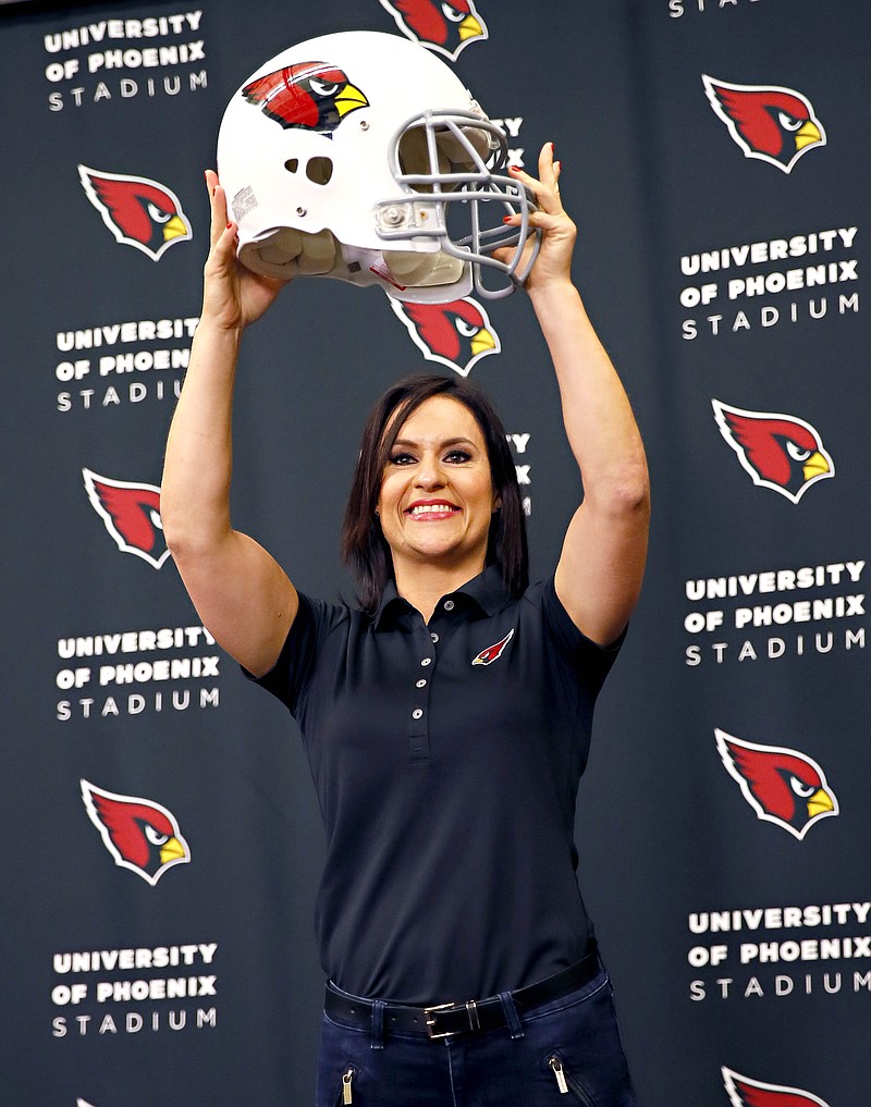 
              Arizona Cardinals training camp coach Dr. Jen Welter poses for photographers after being introduced, Tuesday, July 28, 2015, at the teams' training facility in Tempe, Ariz. Welter is believed to be the first female to hold a coaching position of any kind in the NFL and will be member of the Cardinals coaching staff throughout training camp and the preseason, working with inside linebackers. (AP Photo/Matt York)
            