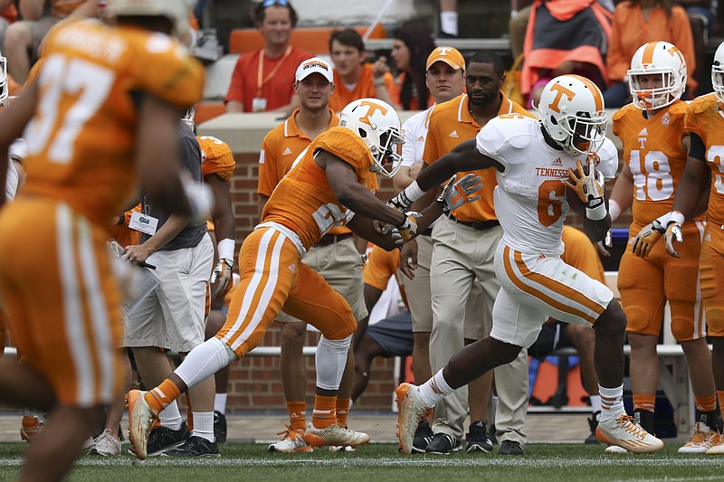 Staff Photo by Dan Henry / The Chattanooga Times Free Press- 4/25/15. The University of Tennessee's Alvin Kamara (6) runs the ball during the Dish Orange & White Game in Knoxville on Saturday, April 25, 2015. Final score was Orange 54, White 44.