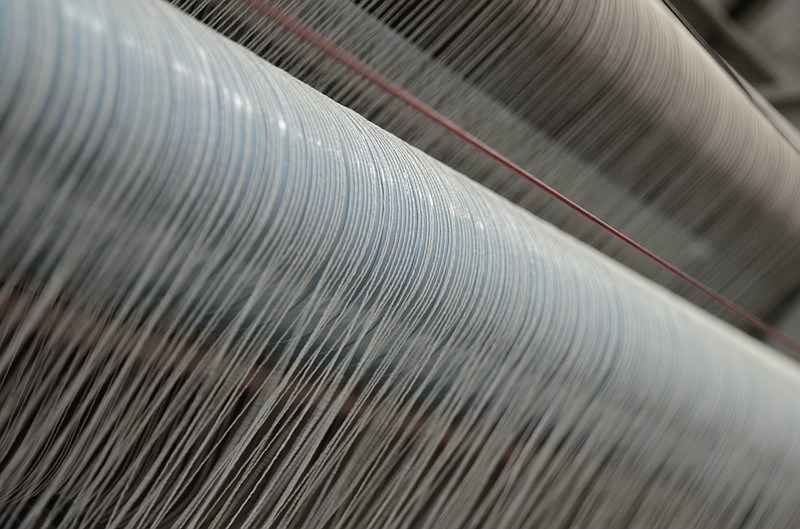 Threads run through machinery Friday at the Dixie Group in North Georgia.