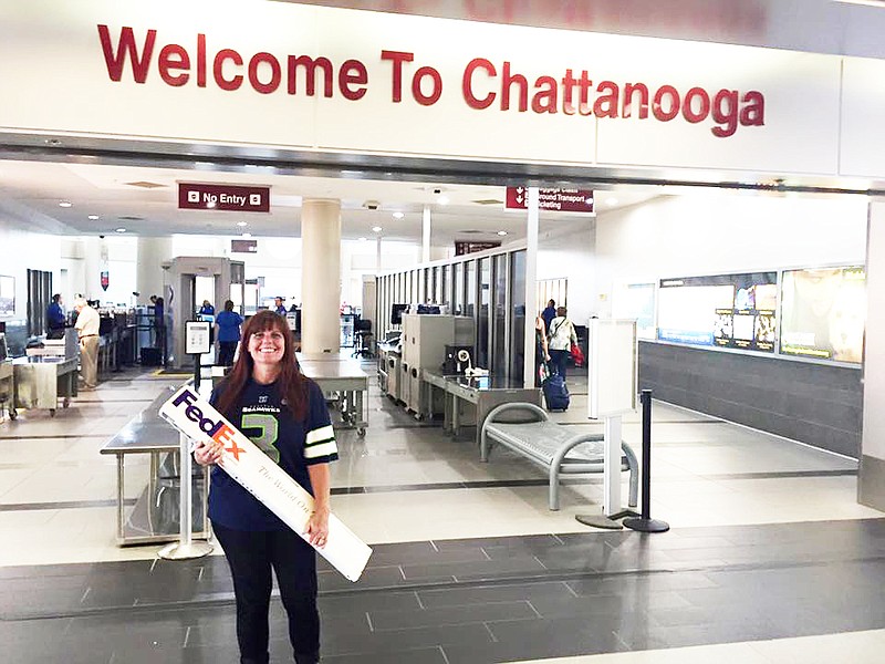 After flying all night on a red-eye from Seattle, Leslie Kidwell Robertson of the Revitalize Port Angeles Facebook group arrived on July 29 with signed sympathy banners for the people of Chattanooga. 