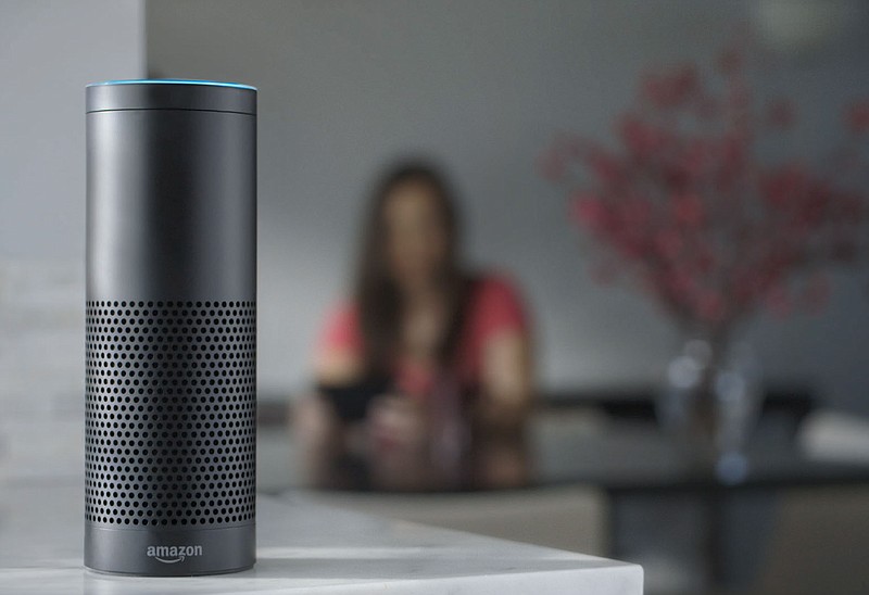  This file product image provided by Amazon shows the Amazon Echo, the latest advance in voice-recognition technology that's enabling machines to record snippets of conversation that are analyzed and stored by companies promising to make their customers' lives better. But the Internet-connected microphones and cameras on the devices are also raising the specter of them being used by corporations or hackers to snoop on private conversations.