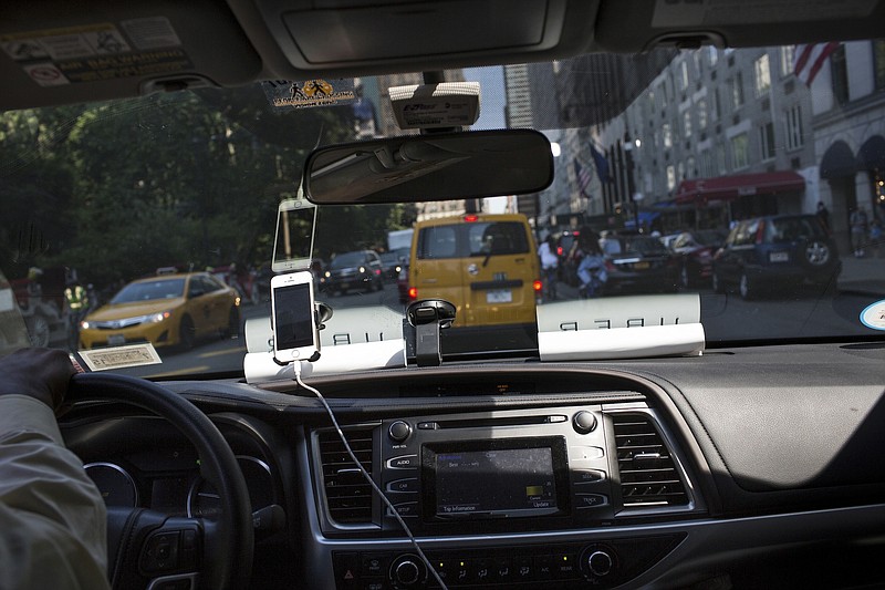 An Uber vehicle drives through New York City earlier this month. Uber, the ride-hailing company, fought back against Mayor Bill de Blasio's efforts to halt the company's expansion.