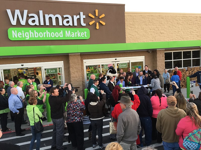 Customers line up to enter Walmart's Neighborhood Market when the new store in Fort Oglethorpe opened in January.