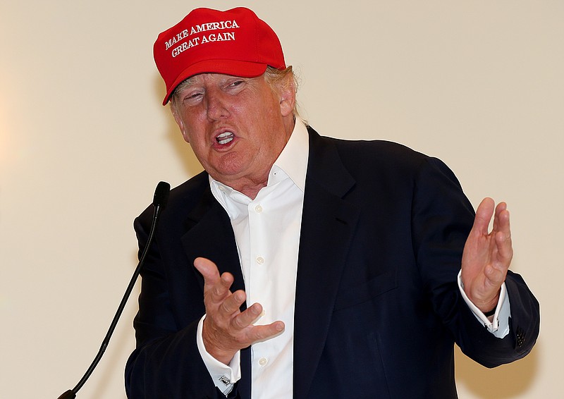 
              Presidential contender Donald Trump speaks to the media during a press conference on the 1st first day of the Women's British Open golf championship on the Turnberry golf course in Turnberry, Scotland, Thursday, July 30, 2015. (AP Photo/Scott Heppell)
            