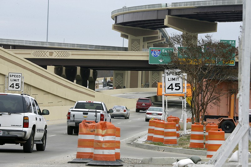 
              FILE - In this Feb. 20, 2015 file photo, traffic passes by a highway construction zone in Little Rock, Ark. Congress sent President Barack Obama a three-month bill to keep highway and transit money flowing to states on Thursday, one day before the deadline for a cutoff of funds. Earlier in the day, the Senate passed a sweeping, long-term transportation bill, setting up discussions with the House this fall on what the future course of transportation policy should be and how to pay for programs. (AP Photo/Danny Johnston, File)
            