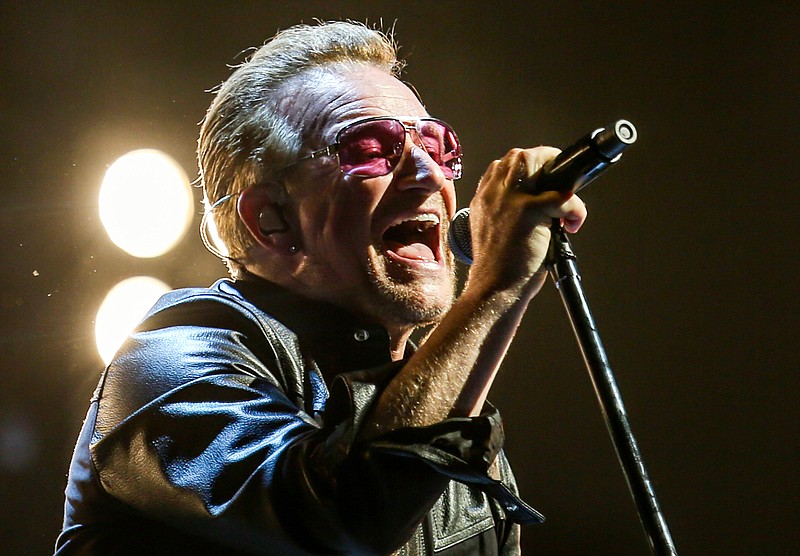 
              FILE - In this May 26, 2015, file photo, Bono of U2 performs at the Innocence + Experience Tour at The Forum in Inglewood, Calif. The special guests at U2’s concert Thursday night, July 30, 2015 in New York, included Paul Simon, Lou Reed’s widow and the woman who called 911 when Bono fell off his bike in New York City last year. (Photo by Rich Fury/Invision/AP, File)
            