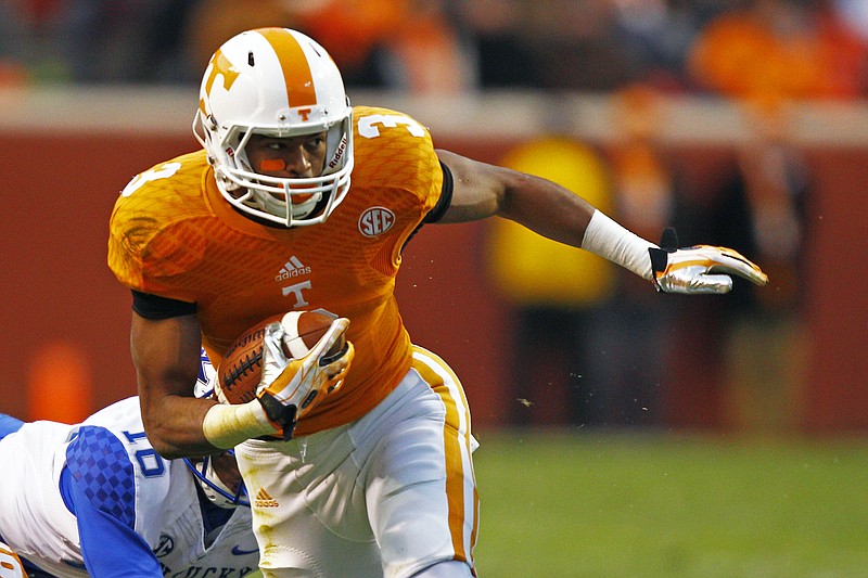 Tennessee wide receiver Josh Malone (3) runs for yardage during an NCAA college football game against Kentucky on Saturday, Nov. 15, 2014 in Knoxville.