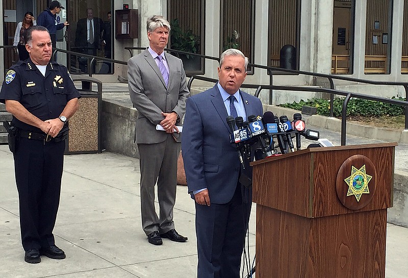 Santa Cruz District Attorney Jeffrey Rosell, right, holds a news where he announced that 15-year-old Adrian Jerry Gonzalez will be charged as an adult in the murder of 8-year-old Madyson Middleton in Santa Cruz, Calif., Wednesday, July 29, 2015.