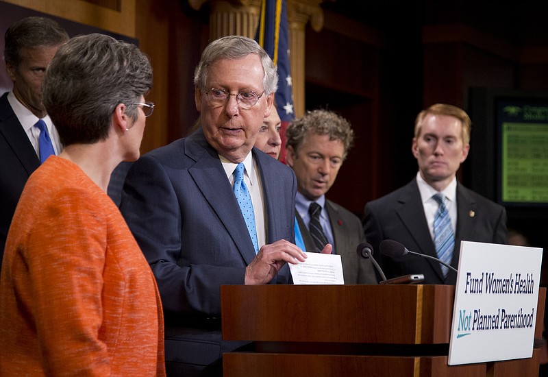 Senate Majority Leader Mitch McConnell of Ky., joined by, from left, Sen. John Thune, R-S.D., Sen. Joni Ernst, R-Iowa, Republican presidential candidate, Sen. Rand Paul, R-Ky., and Sen. James Lankford, R-Okla., speaks during a news conference on Capitol Hill in Washington, Wednesday,July 29, 2015, to discuss Planned Parenthood.