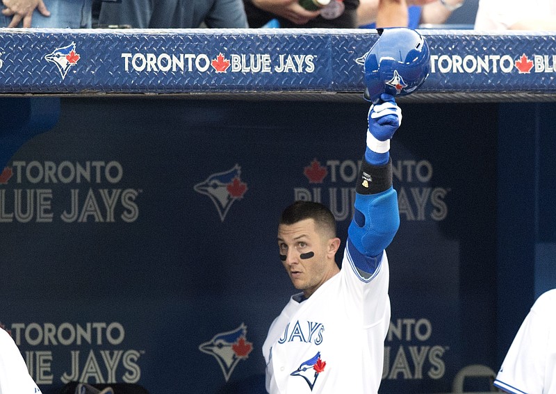 
              Toronto Blue Jays' Troy Tulowitzki tips his helmet after hitting a two-run home run during the third inning of a baseball game against the Philadelphia Phillies, Wednesday, July 29, 2015, in Toronto. (Darren Calabrese/The Canadian Press via AP) MANDATORY CREDIT
            