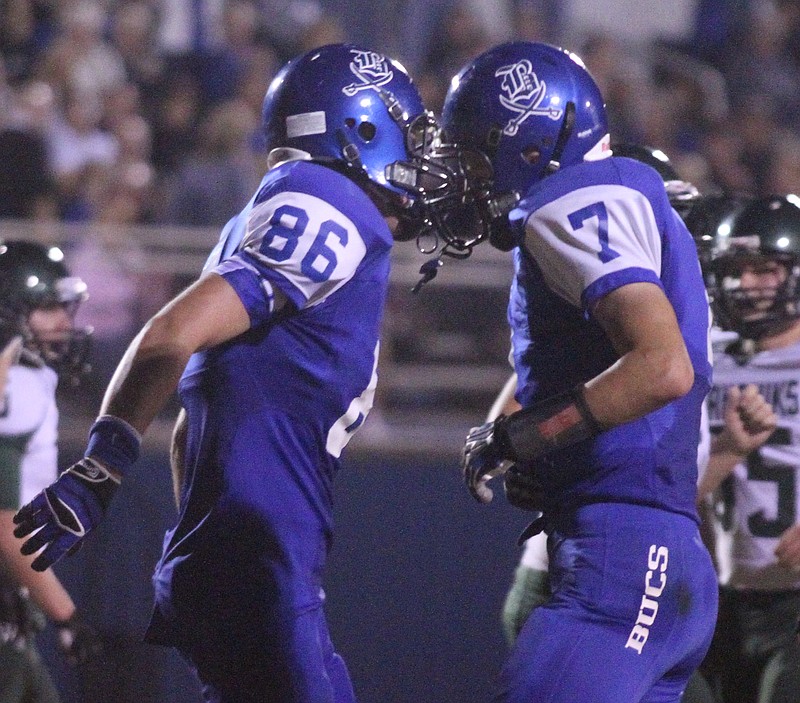 Jack Keebler (86) and Skyler Anderson (7) of Boyd-Buchanan celebrate a play during their game in this 2013 file photo.