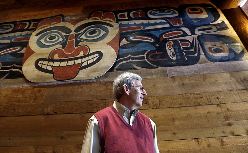 
              In this photo taken Monday, July 27, 2015, Bob Donegan, president of Ivar’s Seafood Restaurants, stands below a Native American artwork in one of the company's restaurants in Seattle. After Seattle's new minimum wage law took effect last April 1, Ivar’s announced that it was jacking up its prices by about 21 percent, eliminating tipping as a routine procedure, and immediately paying all its hourly workers a $15 per hour. They began the new pay rate three years earlier than the law required. (AP Photo/Elaine Thompson)
            